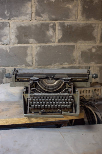 istock Old, antique typewriter close-up in the dust. 1203149988