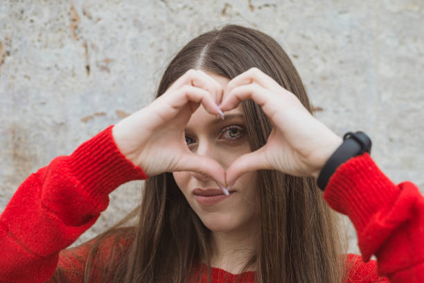 istock Young girl and her heart 1203150788