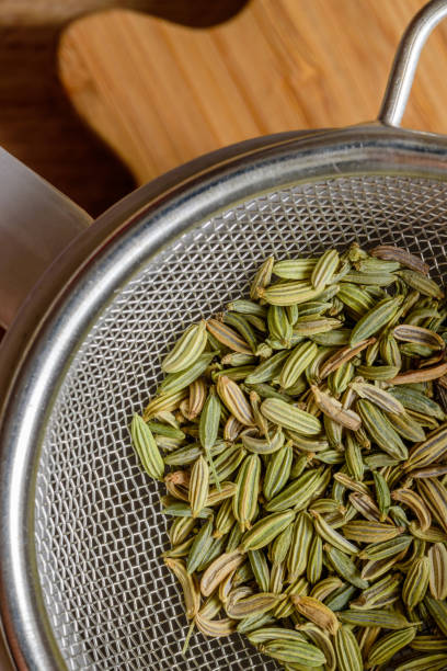 istock fennel seeds inside sieve ready to be brewed for healthy drink 1203153216