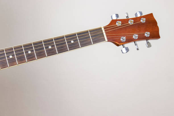 istock Acoustic guitar on isolated background, musical instruments. 1203153354