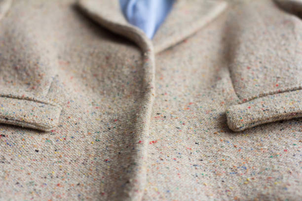 istock Outerwear, front view.Women's jacket made of boucle fabric with two pockets. 1203155342