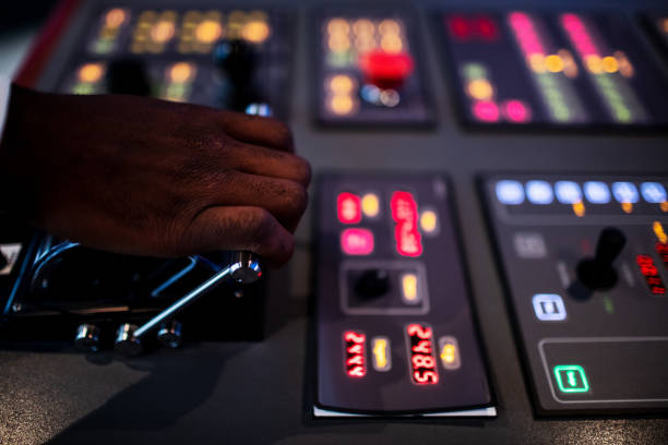 istock Boat captain hands navigating and moving instruments in the cockpit. 1203155517