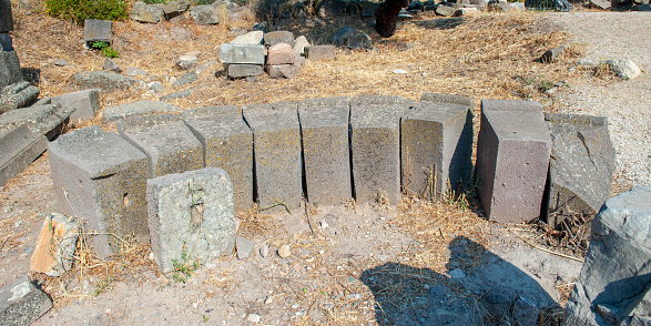 blank stone gravestones and grave slabs in outdoor rural granite workshop on sunny summer day