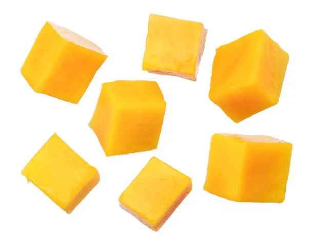 Photo of Set of mango cubes isolated on a white background.