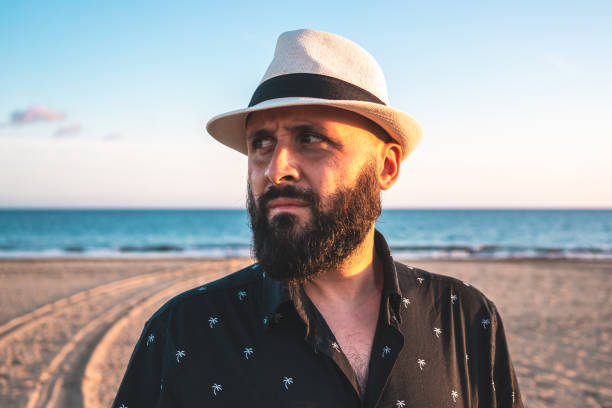 istock Portrait of a man with a beard and a white hat 1203159737