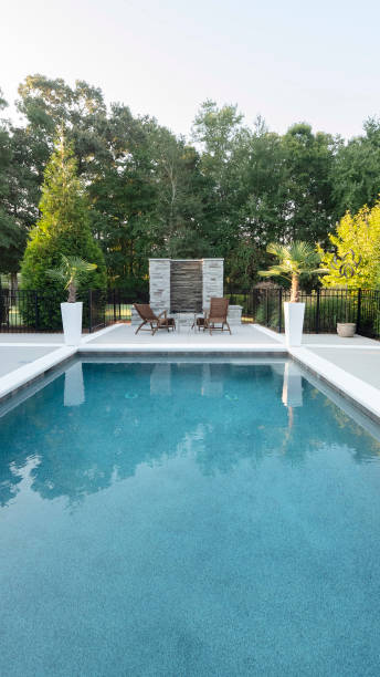 Modern patio overlooking pool. Modern patio overlooking pool. real estate outdoors vertical usa stock pictures, royalty-free photos & images