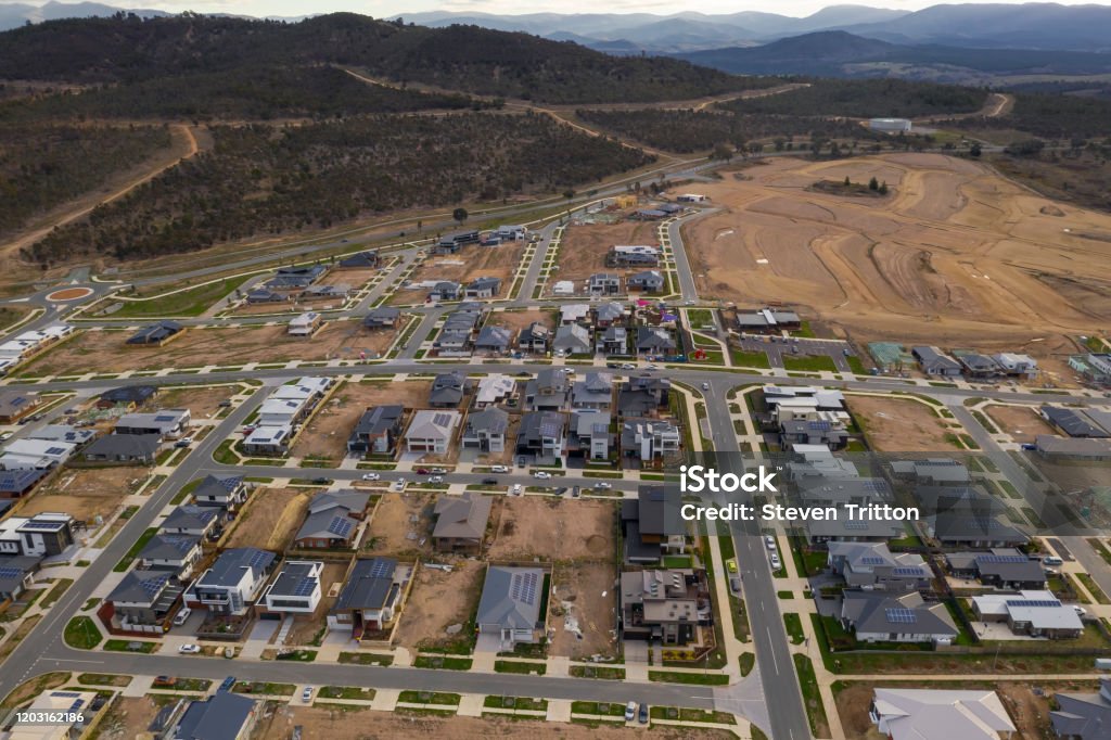 Aerial view of streets, houses and housing development in the newly established suburb of Denman Prospect in Canberra, Australia Aerial View Stock Photo