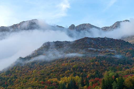 Fog revealing Ligurian Alps mountain range, Piedmont region, Province of Cuneo, north-western Italy