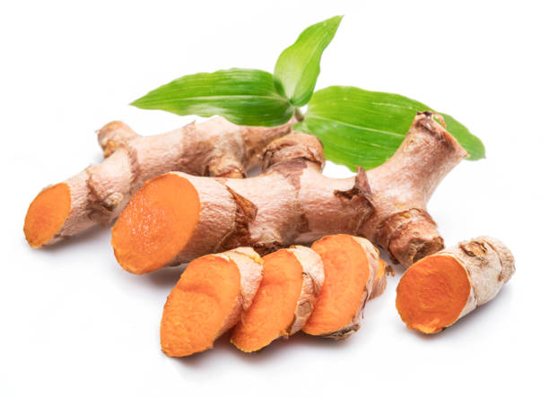 istock Fresh turmeric rhizome and turmeric cuts isolated on white background. 1203163231