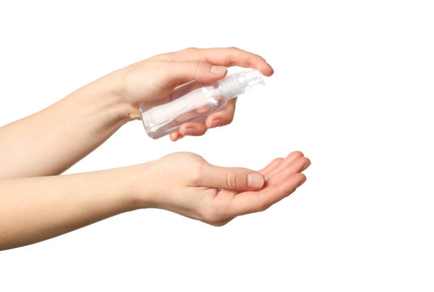 istock Hand holding antiseptic antibacterial disinfectant isolated on white background. Coronavirus protection 1203163575
