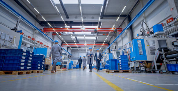 istock Manager and engineer walking in factory 1203164710