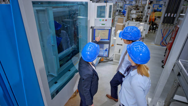 istock Engineers discussing in factory 1203164713