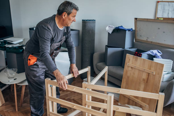 istock Senior carpenter putting together wooden table 1203164935