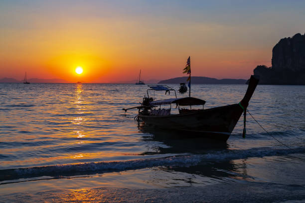 istock Long tail boat sunlight golden sunset background 1203169501