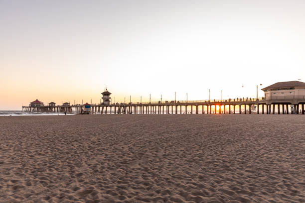 istock Huntington Beach pier and beach at sunset 1203169619