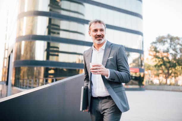 istock Businessman on the move drinking coffee 1203171754