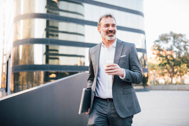 istock Businessman drinking coffee on his way to work 1203171763