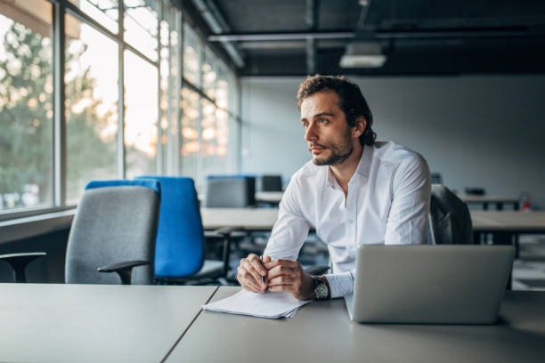istock Modern businessman working in office 1203171829