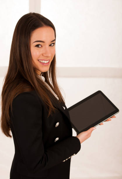 istock asian caucasian business woman browsing web on tablet computer 1203172076
