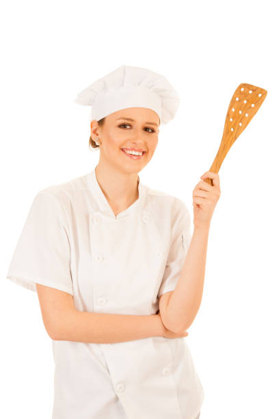 istock Beautiful Happy young chef cooks isolated over white 1203172092