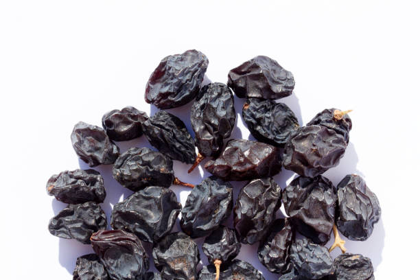 istock Organic black raisins isolated on a white background 1203172272