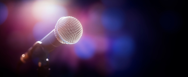 Microphone on stage at concert or music performance background