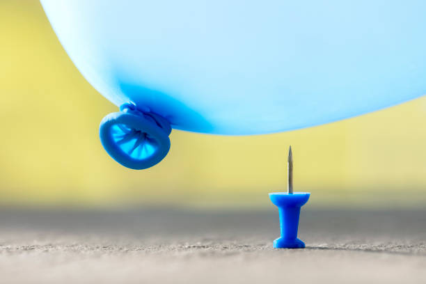 Burst your bubble thumbtack and balloon background Burst your bubble thumb tack and balloon about to pop background sewing needle photos stock pictures, royalty-free photos & images