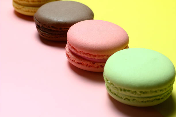 istock colored almond cakes on a multicolored background 1203173848