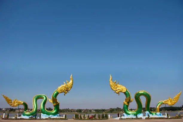 Landmarks and viewpoint with Naga statue of Nongkhai city at riverside mekong river for thai people and foreign travelers travel visit and take photo in Nong khai, Thailand