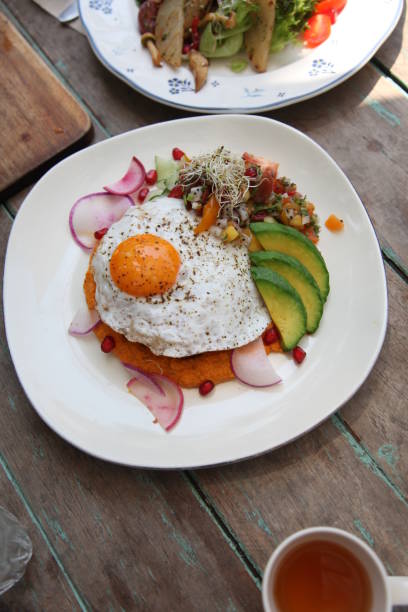 istock lunch and dinner with fried foods, fresh fruits, egg and avocado. 1203176797
