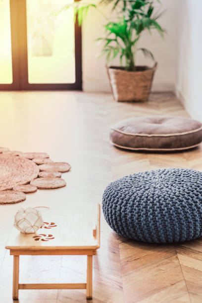 istock Botanical relaxing living room with grey knitted pouf 1203179616