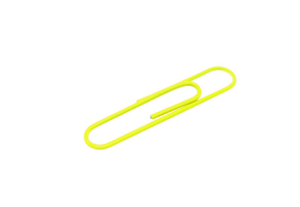 istock Single yellow paper clip on a white background. One paper clip image 1203180569