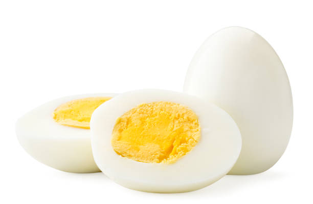 istock Boiled egg and two halves close-up on a white. Isolated 1203181922