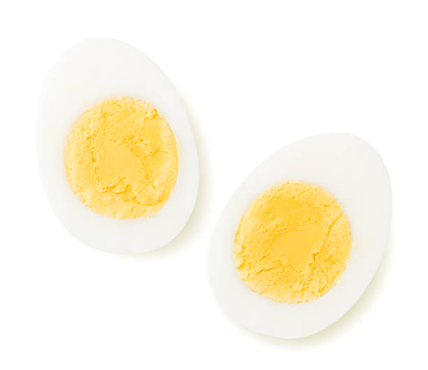 Two halves of a boiled egg on a white. The view from the top