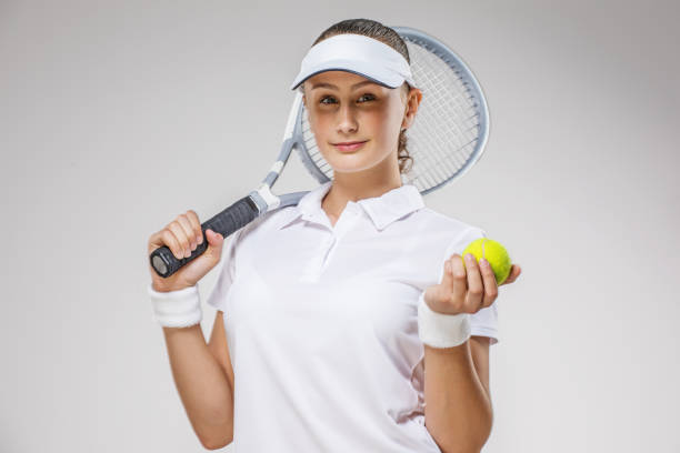 istock Beautiful Young Female Tennis Player in a studio 1203183809