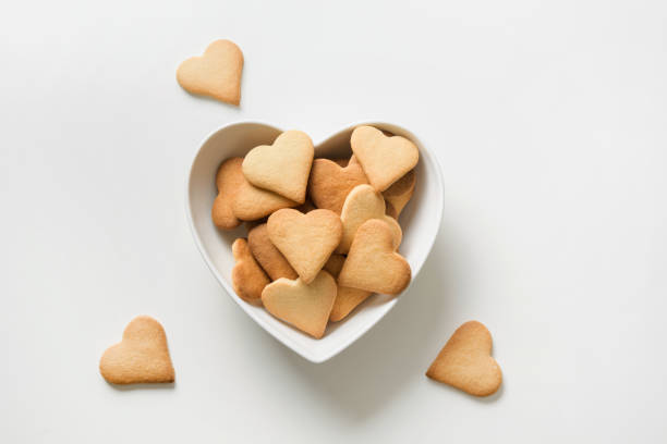 istock Valentines day greeting card with heart shaped cookies on white. View from above. 1203184874