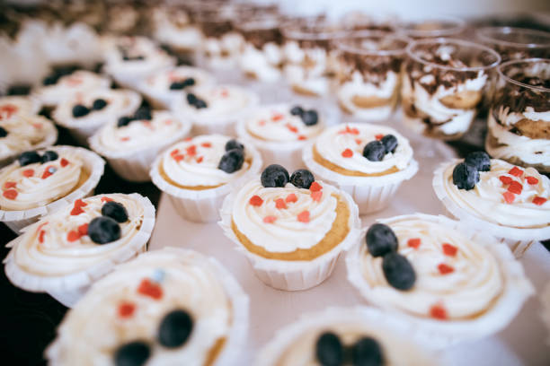 istock dessert with whipped cream and fresh berries on wedding candy bar 1203186296