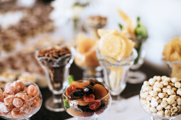 istock cake, nuts, fruits on candy bar on wedding reception 1203186452