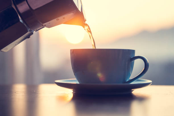 hot coffee pouring into cup - cup coffee pot coffee coffee cup imagens e fotografias de stock