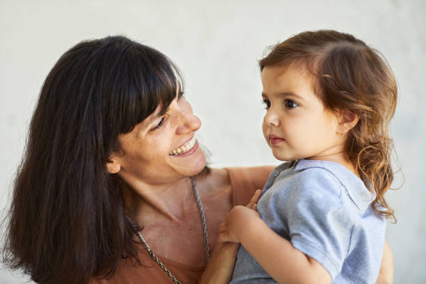 istock Mother looks proudly at her little daughter. 1203187519