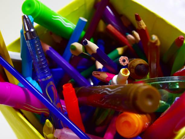 istock box of broken crayons and fluasterone. old pencils for children's creativity. close up 1203187834