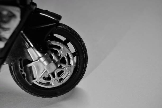 istock black and white photo shadow from a motorcycle wheel is a childhood dream. selective focus. 1203187845