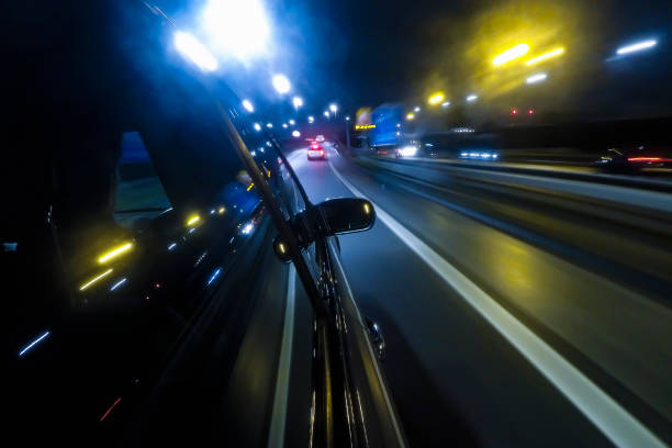 istock Car driving on the Motorway at night 1203187979