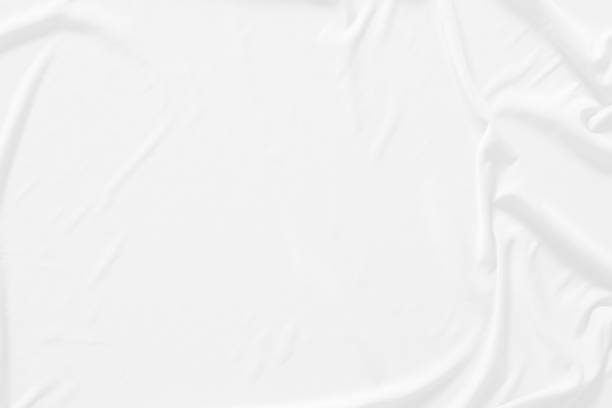 istock White cloth background abstract. Fabric is wrinkled and sofe wave. Material are used in textile assembly. detail texture of pattern design, elegance with free space copy for backdrop or wallpaper. 1203188136