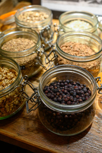 istock Tastes of gin, botanicals ingredients for gin distillery process, dried orange peels, juniper berries, heather, angelica, coriander, clove, cassia, liquorice 1203189517