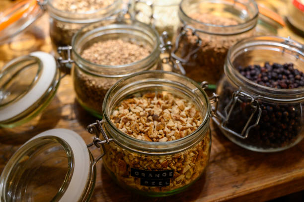 istock Tastes of gin, botanicals ingredients for gin distillery process, dried orange peels, juniper berries, heather, angelica, coriander, clove, cassia, liquorice 1203189544