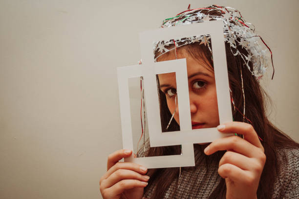 istock Teenage girl holding a frame 1203189603