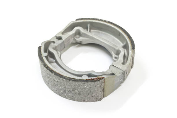 istock motorcycle brake shoes on white background, isolated, Car service. 1203191771