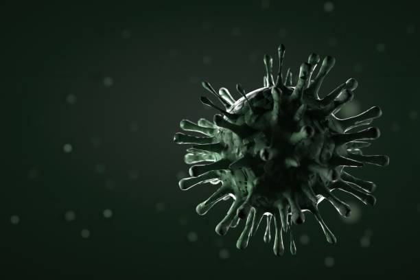 istock 3d illustration, close up of microscope Influenza Virus on green background 1203191874