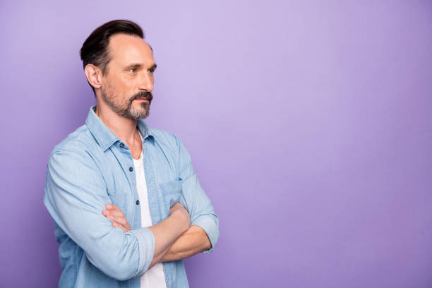 istock Turned photo of masculine freelancer man cross hands ready solve start-up problems wear stylish clothing isolated over purple color background 1203192964